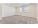 Bright bedroom features neutral carpet, recessed lighting and two large windows at 39876 Floyd St, Elizabeth, CO 80107