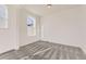 Light-filled bedroom with neutral carpet and large windows offering pleasant views at 39876 Floyd St, Elizabeth, CO 80107