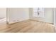 Modern bedroom with hardwood floors and a large window providing natural light at 39876 Floyd St, Elizabeth, CO 80107