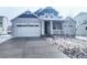 Charming home featuring a covered front porch, attached garage, and well-kept landscaping at 39876 Floyd St, Elizabeth, CO 80107