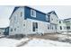 Rear exterior showcasing multiple windows for natural light and a small deck or patio area at 39876 Floyd St, Elizabeth, CO 80107
