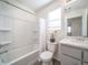 Clean bathroom with a shower/tub combo, toilet and vanity at 45004 Sunflower Ln, Bennett, CO 80102