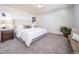 Main bedroom with plush carpet and nightstands at 45004 Sunflower Ln, Bennett, CO 80102