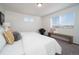 Main bedroom with window blinds, carpet, and bench at 45004 Sunflower Ln, Bennett, CO 80102