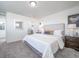 Spacious main bedroom with mirror and large bed at 45004 Sunflower Ln, Bennett, CO 80102
