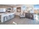 Modern kitchen with gray cabinets, stainless steel appliances and an island at 45004 Sunflower Ln, Bennett, CO 80102