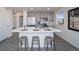 Modern kitchen with gray cabinets, stainless steel appliances and an island at 45004 Sunflower Ln, Bennett, CO 80102