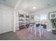 Home office featuring built-in shelving and a workspace with natural light at 45004 Sunflower Ln, Bennett, CO 80102