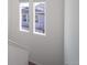 View from the stairs showing two windows at 45004 Sunflower Ln, Bennett, CO 80102