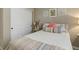 Comfortable bedroom featuring a full-size bed, stylish decor, and ample closet space at 9592 Firenze Way, Highlands Ranch, CO 80126