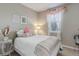 Inviting bedroom with soft natural light and charming decor for a tranquil and restful atmosphere at 9592 Firenze Way, Highlands Ranch, CO 80126