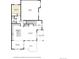 First floor layout featuring a kitchen, living room, dining area, and garage at 9592 Firenze Way, Highlands Ranch, CO 80126