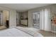 Spacious main bedroom with balcony access, ensuite bathroom and walk-in closet at 9592 Firenze Way, Highlands Ranch, CO 80126