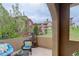 Relaxing patio with comfortable seating and views of the surrounding neighborhood and lush landscaping at 9592 Firenze Way, Highlands Ranch, CO 80126