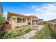 Expansive backyard features a covered patio with bridge accent at 17670 W 94Th Dr, Arvada, CO 80007