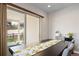 Dining room area with sliding glass doors leading to the outside at 17670 W 94Th Dr, Arvada, CO 80007