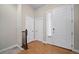 Bright entryway featuring hardwood floors and ample natural light, creating an inviting first impression for guests at 17670 W 94Th Dr, Arvada, CO 80007