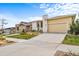 Inviting single-Gathering home with an attached two-car garage and well-manicured lawn at 17670 W 94Th Dr, Arvada, CO 80007