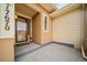 Covered front porch with neutral colors and shade at 17670 W 94Th Dr, Arvada, CO 80007