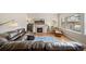 Comfortable living room with fireplace, hardwood floors and lots of space at 17670 W 94Th Dr, Arvada, CO 80007