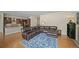 Spacious open living area with hardwood floors, leading to the kitchen, ideal for entertaining and Gathering gatherings at 17670 W 94Th Dr, Arvada, CO 80007