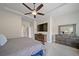 Spacious main bedroom with a tray ceiling, ceiling fan, and a full ensuite bathroom at 17670 W 94Th Dr, Arvada, CO 80007