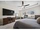 This main bedroom is spacious with plenty of natural light and a comfortable workspace at 17670 W 94Th Dr, Arvada, CO 80007