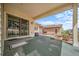 Relaxing covered patio offers seamless indoor-outdoor living and a grill at 17670 W 94Th Dr, Arvada, CO 80007