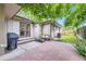 Cozy back patio area with a grill, outdoor seating and brick pavers at 13211 W 32Nd Ave, Golden, CO 80401