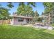 Charming backyard featuring a picnic table, landscaped garden and lush lawn at 13211 W 32Nd Ave, Golden, CO 80401