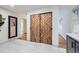 Stylish bathroom featuring modern sliding doors, tiled floors, a mirror, and modern vanity at 13211 W 32Nd Ave, Golden, CO 80401
