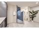 Modern bathroom with a glass-enclosed shower, neutral tile, sleek fixtures, and ample space at 13211 W 32Nd Ave, Golden, CO 80401