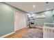 Bright bedroom with a glider, closet, wood floors, and large window at 13211 W 32Nd Ave, Golden, CO 80401