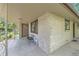 Inviting front porch with modern decor, brick exterior, and secure entry at 13211 W 32Nd Ave, Golden, CO 80401