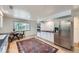 Bright kitchen featuring stainless steel appliances and an adjacent dining area by the window at 13211 W 32Nd Ave, Golden, CO 80401