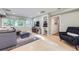 Bright living room with large windows, hardwood floors, and a modern design, perfect for relaxation at 13211 W 32Nd Ave, Golden, CO 80401