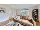 Cozy living room with comfortable seating and a view to the outdoors through a large window at 13211 W 32Nd Ave, Golden, CO 80401