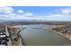 Sprawling aerial view showcasing a lake, the surrounding neighborhood, and the city skyline at 4072 W 17Th Ave, Denver, CO 80204