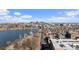Picturesque aerial view featuring a serene lake and a distant cityscape, creating a tranquil yet urban backdrop at 4072 W 17Th Ave, Denver, CO 80204