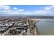 Panoramic aerial view highlighting the mix of city and nature, with a lake and mountain view in the distance at 4072 W 17Th Ave, Denver, CO 80204