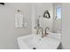 Bathroom vanity featuring a sink, mirror, modern fixtures and decor at 4072 W 17Th Ave, Denver, CO 80204