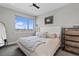 Serene bedroom features a plush bed, large window with scenic views, and modern decor at 4072 W 17Th Ave, Denver, CO 80204