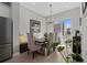 Dining area featuring a dining table, four chairs, window and natural light at 4072 W 17Th Ave, Denver, CO 80204