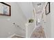 Bright hallway featuring a colorful rug runner, artwork, and access to various rooms at 4072 W 17Th Ave, Denver, CO 80204