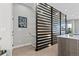 Stylish hallway with a modern privacy screen, sleek flooring, and contemporary design at 4072 W 17Th Ave, Denver, CO 80204