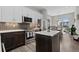 Contemporary kitchen featuring stainless steel appliances, island, and dining nook at 4072 W 17Th Ave, Denver, CO 80204