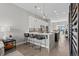 Kitchen featuring island with seating, pendant lighting, and modern finishes at 4072 W 17Th Ave, Denver, CO 80204