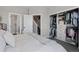 Bright main bedroom with open walk-in closet and ensuite bathroom featuring contemporary designs at 4072 W 17Th Ave, Denver, CO 80204