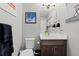 Stylish powder room with modern vanity, elegant fixtures, and contemporary artwork at 4072 W 17Th Ave, Denver, CO 80204