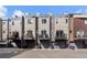 Townhomes with private balconies, rear garages, and a basketball hoop offering outdoor space and recreation at 4072 W 17Th Ave, Denver, CO 80204